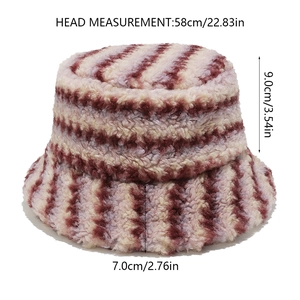 Detailed view of striped faux fur bucket hat with dimension labels and plush texture