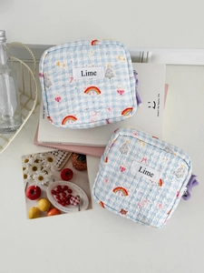 Detailed view of two quilted rainbow pouches with soft check pattern and lime labels