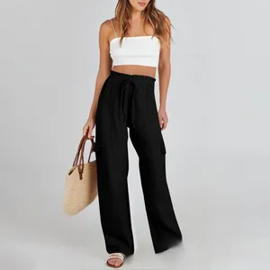 Detail of high-waist drawstring cotton linen cargo pants with large side pockets