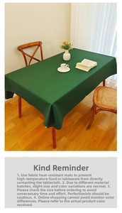 Detail of waterproof dark green tablecloth with a premium matte texture for dining tables