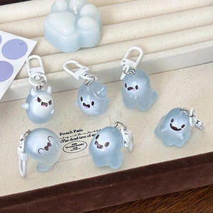 Detail of six light blue translucent jelly ghost charms with cute facial expressions