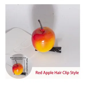 Detail of red apple hair clip with 4cm width and 5cm height on black alligator clip
