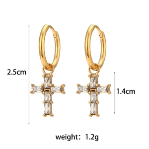 Detail view of gold cross earrings with zircon inlays including size and weight specs