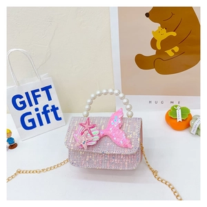 Detail of girls' sequin mermaid bag with pearl handle, shell charm and gold chain