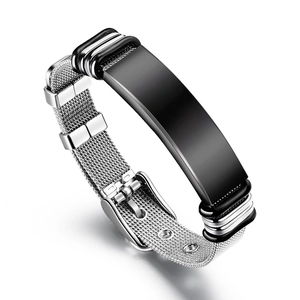 Detailed macro view of adjustable silver mesh steel bracelet with black engravable plaque