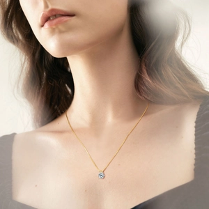 Classic 925 sterling silver six-prong moissanite pendant necklace on female model