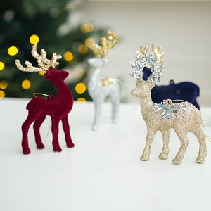 Detailed close-up of glitter and flocked Christmas reindeer ornaments with hanging cords