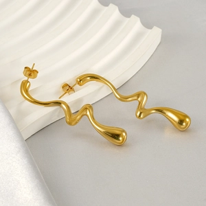 Minimalist liquid gold twisted metal earrings with a modern fluid aesthetic design