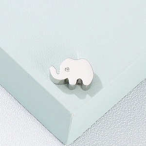 Polished silver stainless steel elephant pendant with crystal eye on light blue display