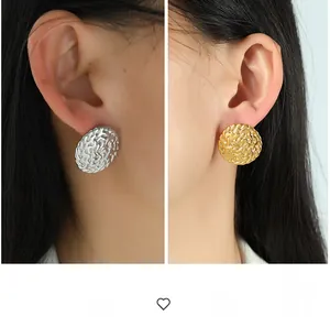 Detailed comparison of large vintage gold and silver embossed textured disc earrings