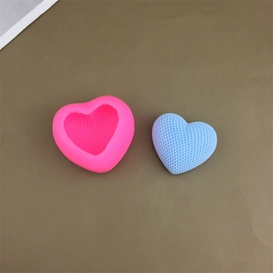 Pink heart silicone mold with woven texture and blue heart-shaped finished candle cake