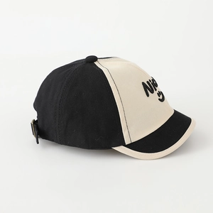Detail of color-blocked kids baseball cap featuring nice smiley face embroidery and strap