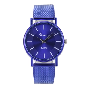 Detailed close-up of blue quartz watch with sunray dial and Milanese mesh band