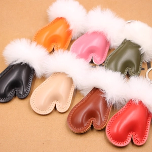 Colorful heart-shaped leather keychains with faux fur trim in multiple vibrant shades