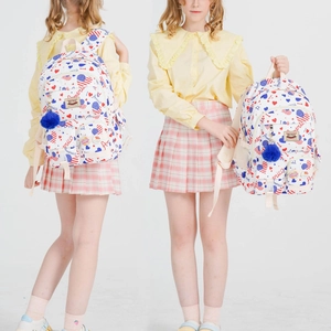 Detail of American campus backpack with flag print, blue pompom and mesh side pocket