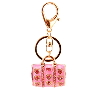 Pink enamel handbag keychain with heart crystals and golden finish for women
