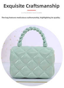 Detail view of mint green jelly bag with diamond lattice pattern and twisted top handle