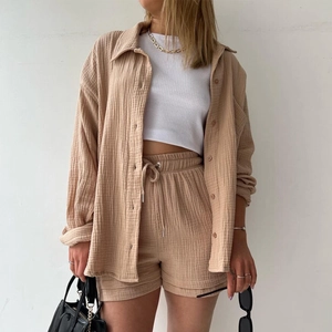 Women's casual two-piece beige set featuring long sleeve shirt and drawstring shorts