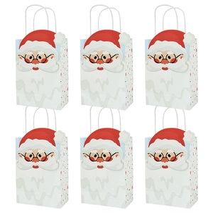 Detail of Christmas kraft paper gift bags with cartoon Santa Claus prints and star patterns