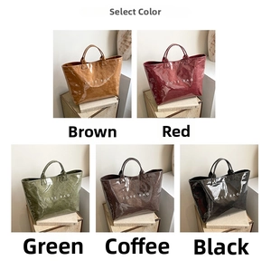 Close-up of gloss tote bags in brown, red, green, coffee, and black with logo