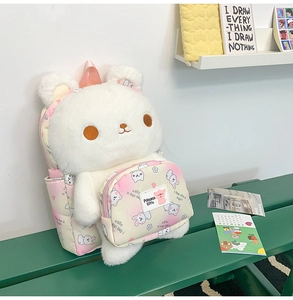 Detail of plush bunny backpack with gradient pink pocket and cute 3D ears design