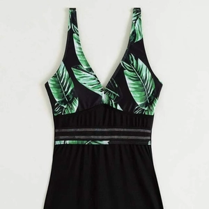 Women's V-neck one-piece swimsuit with tropical leaf print and mesh waist stripes