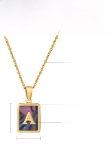 Close-up of golden stainless steel square pendant with shell inlay and letter A