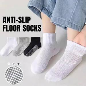 Mesh baby floor socks with anti-slip silicone dots in white, grey, and black multi-pack