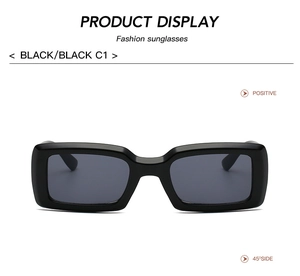 Detail view of stylish black rectangle sunglasses with high-shine resin frames