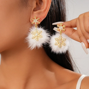 Sparkling rhinestone snowflake earrings with white plush pompom for winter fashion style