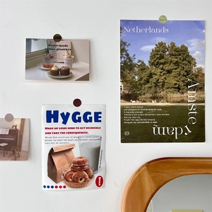 Aesthetic Morandi dot stickers securing scenic art cards on a clean white wall