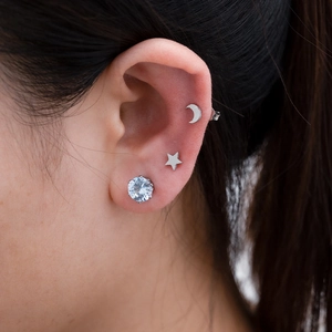 Three-piece set of stainless steel earrings featuring moon, star, and round zircon studs