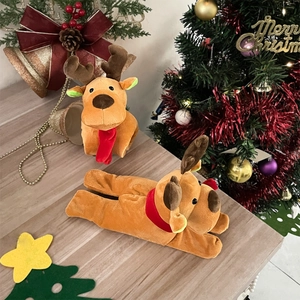 Close-up of plush reindeer toys with red scarves in a festive Christmas setting