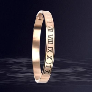 Rose gold stainless steel bangle featuring hollowed Roman numerals and a secure buckle