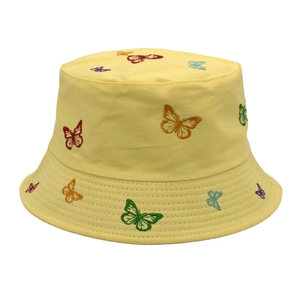Close-up of colorful butterfly embroidery on a pale yellow canvas bucket hat detail