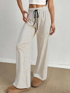 Women's black and white striped wide-leg lounge pants with comfortable drawstring waist