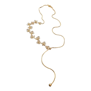 Elegant gold-plated flower necklace with white petals and delicate snake chain on white base