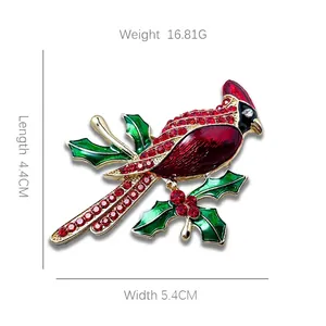 Sparkling cardinal bird brooch with red crystals and holly leaves, 4.4cm x 5.4cm size