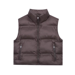Detailed close-up of a dark coffee quilted vest featuring a stand collar and zip pockets