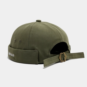 Dark green miki hat with white ART-ZOD embroidery and vintage brass buckle closure
