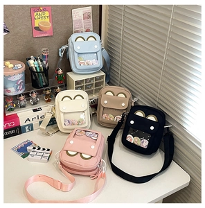Collection of colorful canvas crossbody bags with transparent heart windows for badges