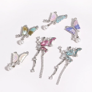 Detail view of butterfly pendant with zircon inlay and hanging pearl drop ornaments