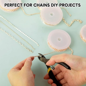 DIY jewelry project showing a tool cutting gold-plated cross chains on a green background