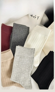Detailed view of combed cotton ribbed crew socks in multiple solid color options
