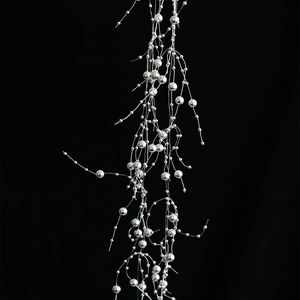 Silver beaded garland for Christmas tree decoration with metallic spheres on black background