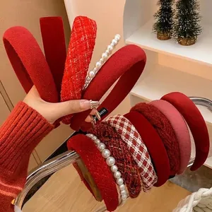 Elegant red Christmas headbands in velvet and pearls for festive winter hair styling
