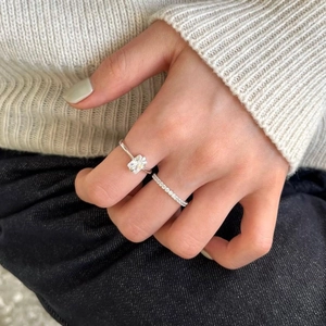 Close-up of minimalist S925 sterling silver rectangular zircon and pavé band ring set