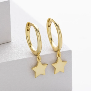 Detail view of golden S925 sterling silver hoop earrings with star-shaped charms