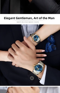 Close-up of luxury couple quartz watches with blue dials and two-tone gold steel bands