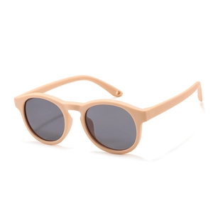 Kids silicone round sunglasses in matte orange with dark lenses and strap holes